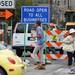 Pedestrians walk past signs as construction continues along Fourth Avenue between East Huron and Liberty streets in downtown Ann Arbor on Monday, July 29, 2013. Melanie Maxwell | AnnArbor.com